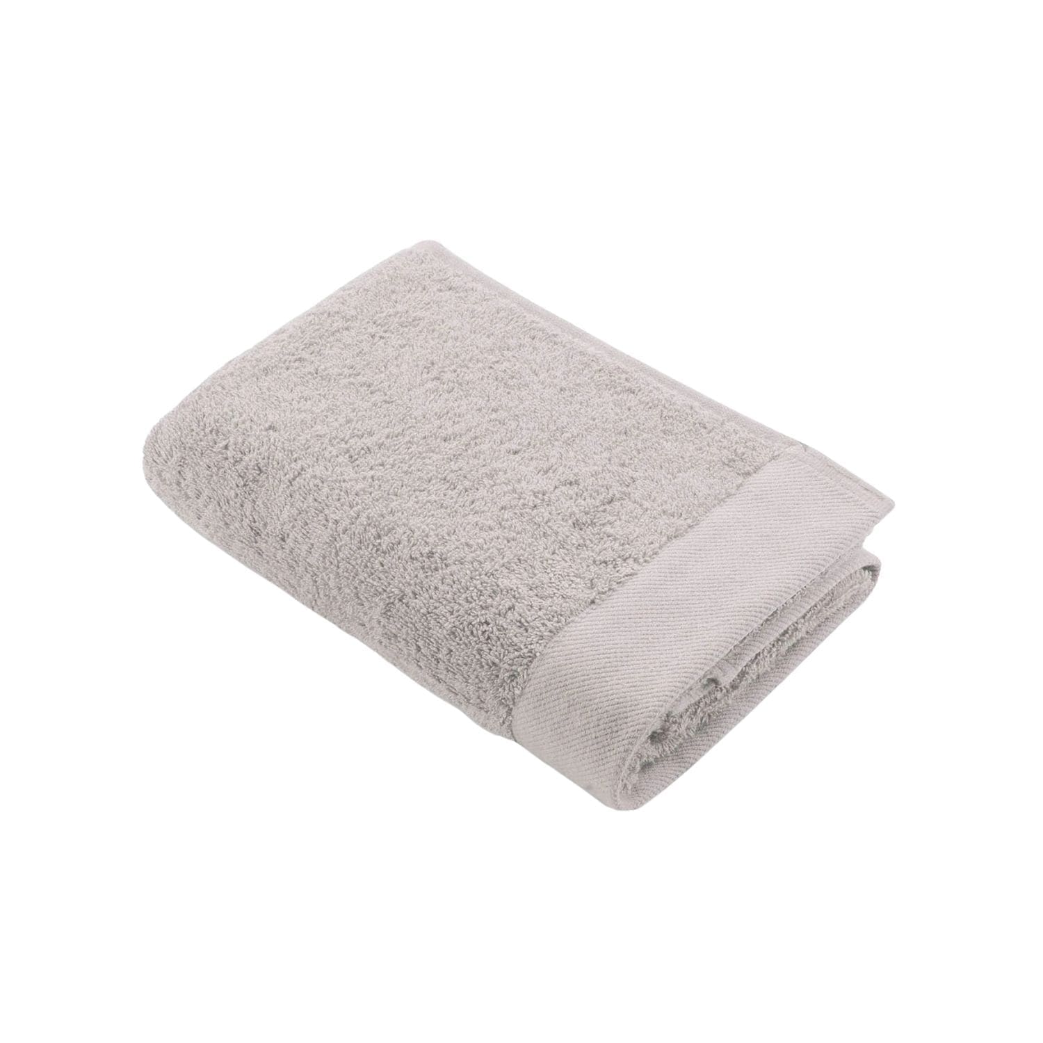 Grijze handdoek opgevouwen en klaar voor gebruik.
